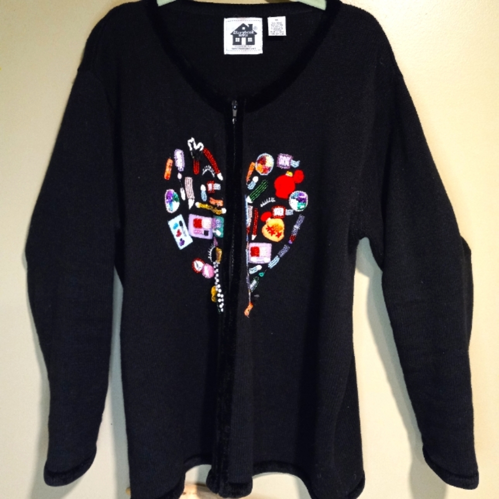 Storybook Knit makeup themed zip up cardigan